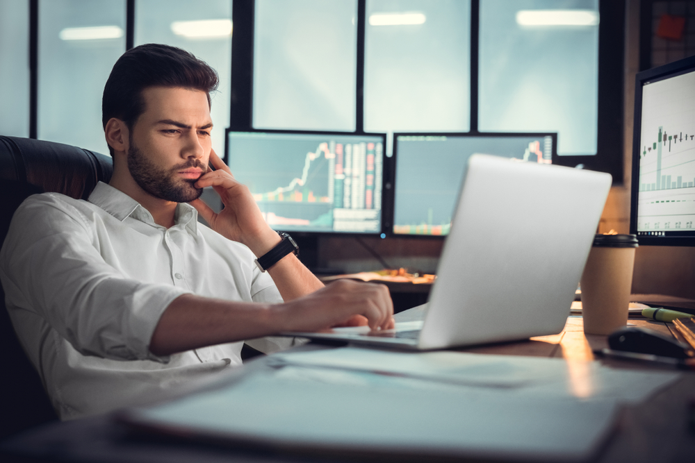 Young,Male,Trader,At,Office,Work,Concept,Sitting,Browsing,Internet | Best Forex Tips